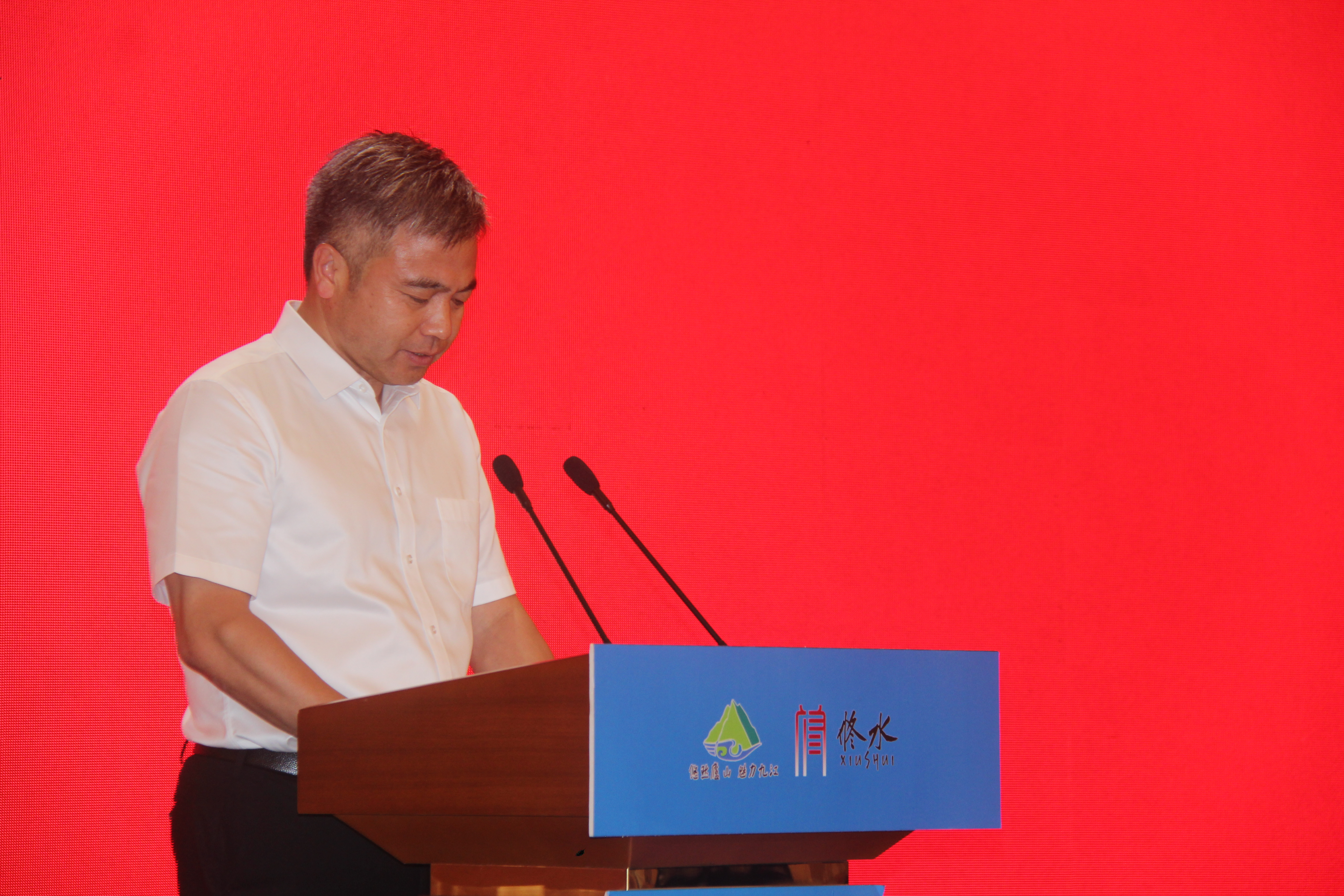 图一 郑庆华在2022九江市旅发大会上作典型发言.JPG