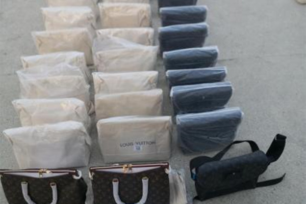 廣東茂名警方打掉兩個生產假「LV」商包團伙